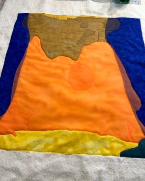 art quilt with a lot of orange and blue